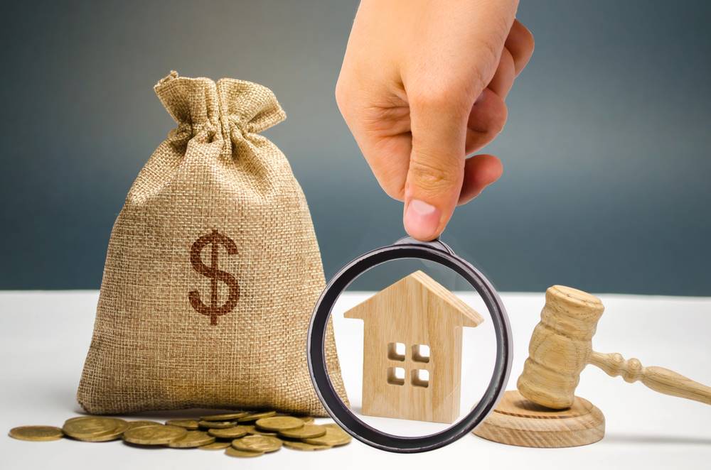 Foreign Investment Laws Image of a bag of money, a house, and a gavel symbolizing property confiscation, featuring 411 Corporate Law and highlighting foreign investment laws, ensuring it aligns with the page's context on property rights and legal regulations in international investments.